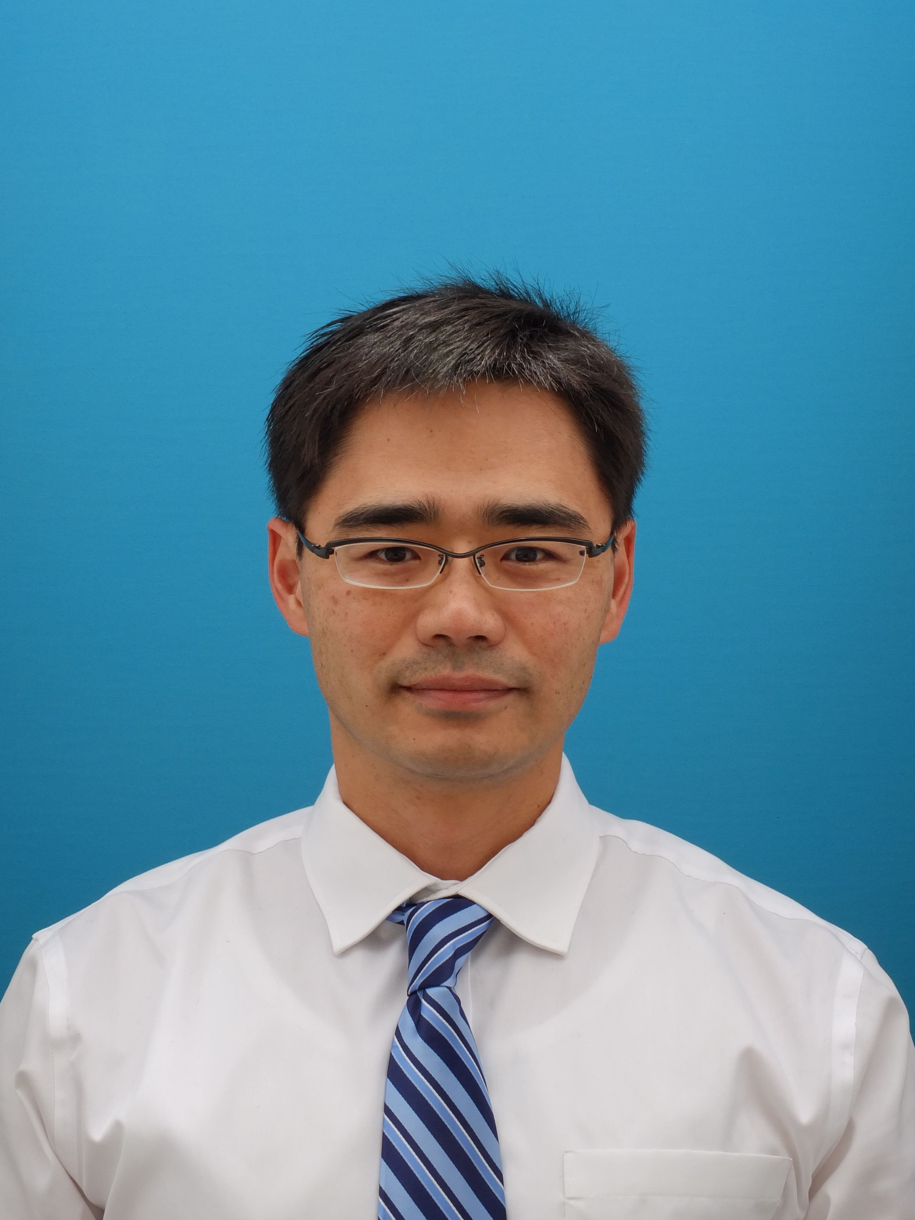 當間　健明